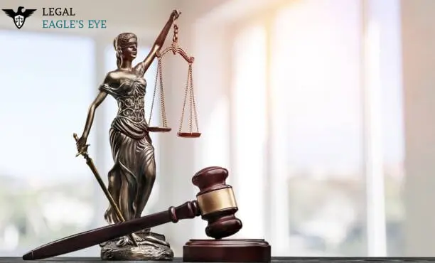 About Legal Eagle's Eye - Statue Placed with Hammer on Table Handling the Balance